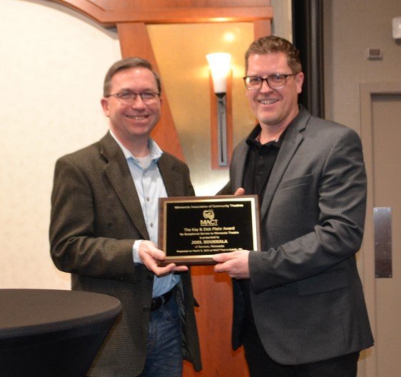 Rick Breuer presenting Joel Soukkala with the Fliehr Award